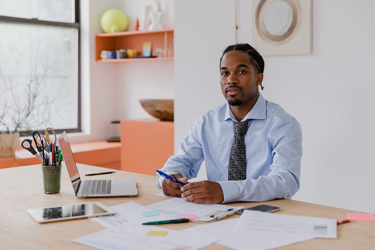 An accountant working through a client file at a desk